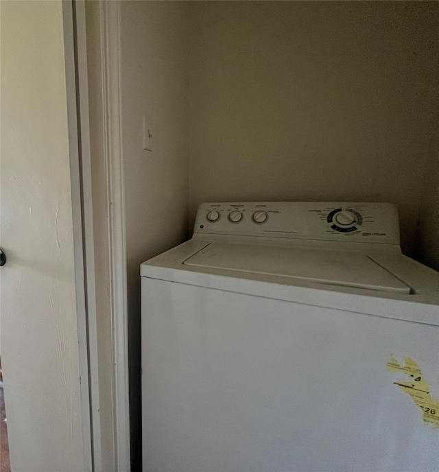 laundry room featuring laundry area and washer / clothes dryer