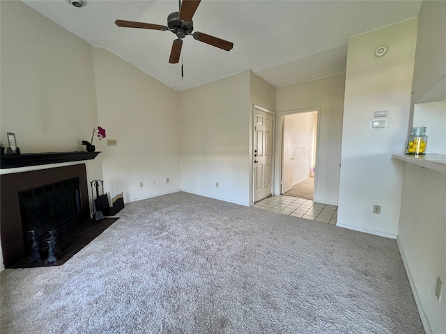 unfurnished living room with ceiling fan and light carpet