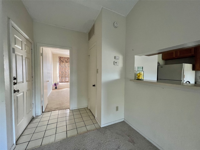 interior space featuring light colored carpet