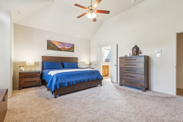 carpeted bedroom with ensuite bathroom, high vaulted ceiling, and ceiling fan