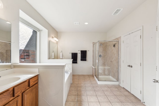 bathroom featuring vanity, tile patterned floors, and independent shower and bath