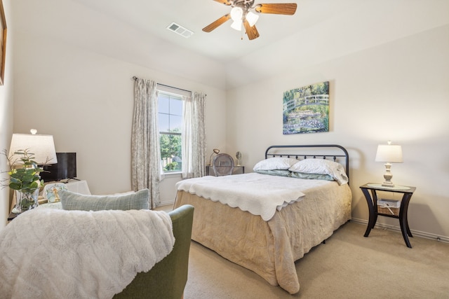 bedroom featuring ceiling fan, light carpet, and lofted ceiling