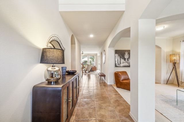 hallway featuring ornamental molding