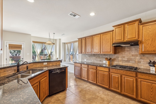 kitchen featuring backsplash, stainless steel gas cooktop, sink, black dishwasher, and hanging light fixtures