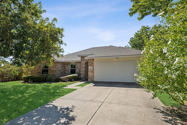 ranch-style home with a garage and a front yard