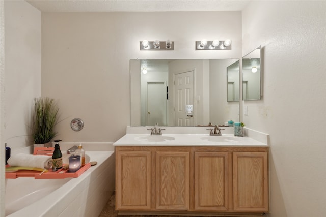 bathroom with vanity and a tub