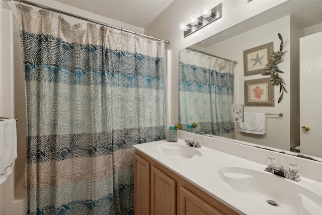 bathroom featuring vanity and a textured ceiling