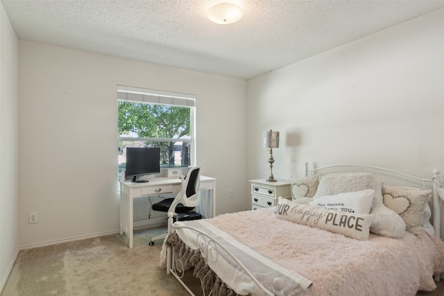 carpeted bedroom with a textured ceiling