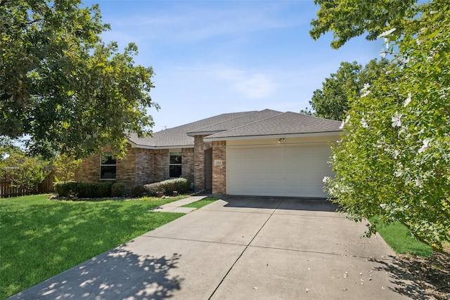 ranch-style home with a front yard and a garage