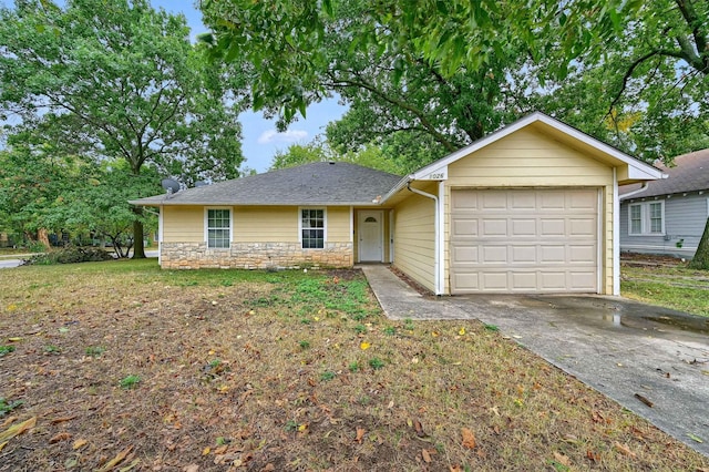 ranch-style house with a front yard and a garage