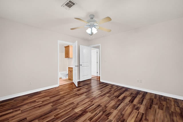 unfurnished bedroom with connected bathroom, ceiling fan, and hardwood / wood-style flooring