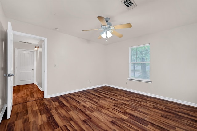 unfurnished room featuring ceiling fan and dark hardwood / wood-style flooring