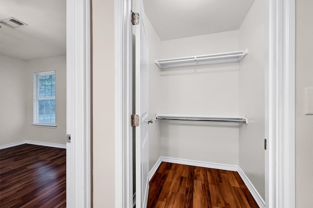 walk in closet featuring hardwood / wood-style floors