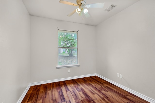 unfurnished room featuring ceiling fan, hardwood / wood-style floors, and a wealth of natural light