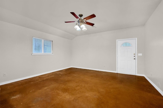 spare room featuring concrete floors and ceiling fan