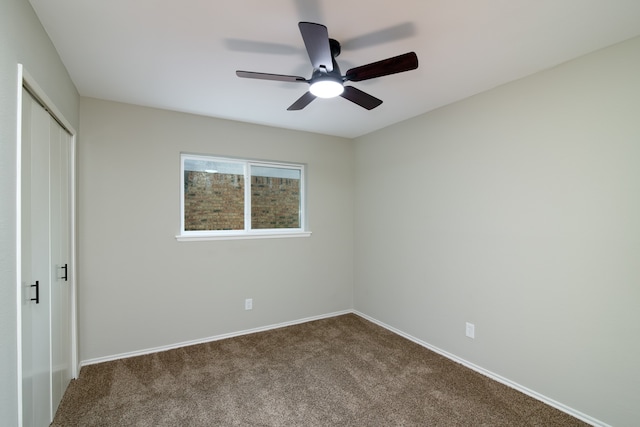 unfurnished bedroom with ceiling fan, a closet, and carpet