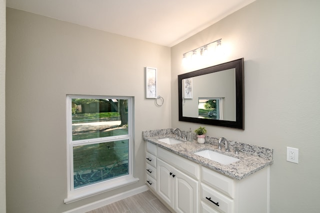 bathroom featuring vanity and hardwood / wood-style flooring