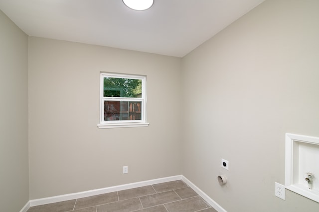 laundry area featuring electric dryer hookup and tile patterned floors