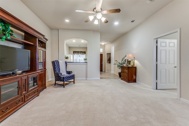 sitting room with light carpet and ceiling fan