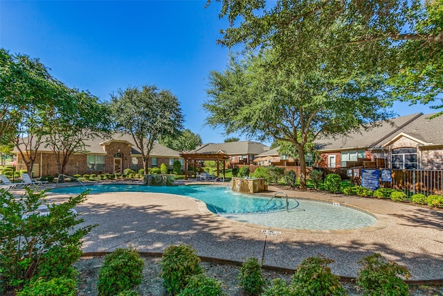 view of pool featuring a gazebo, pool water feature, and a patio area