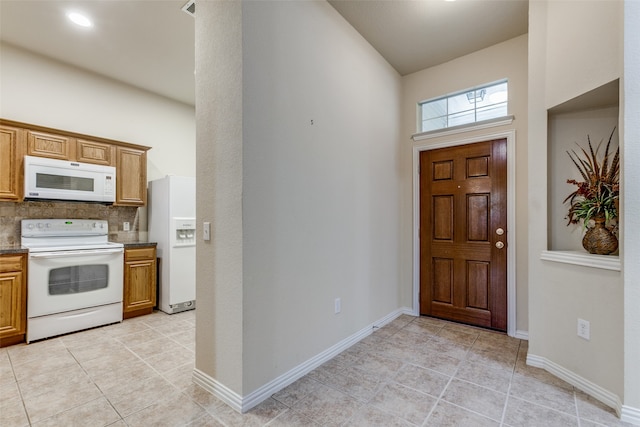 entrance foyer featuring light tile patterned floors