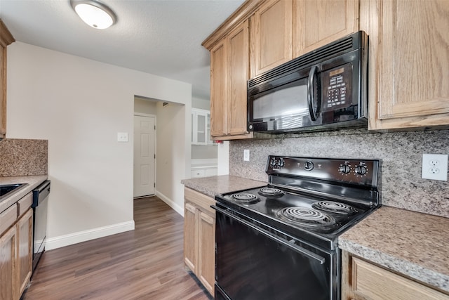 kitchen with a textured ceiling, dark wood-type flooring, tasteful backsplash, black appliances, and light brown cabinets