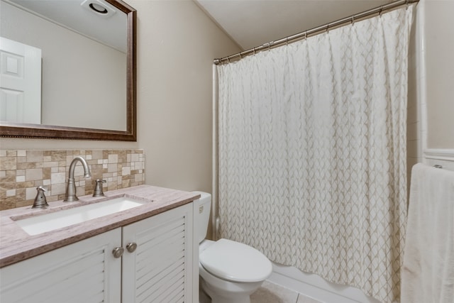 full bathroom with tile patterned flooring, decorative backsplash, shower / tub combo with curtain, vanity, and toilet