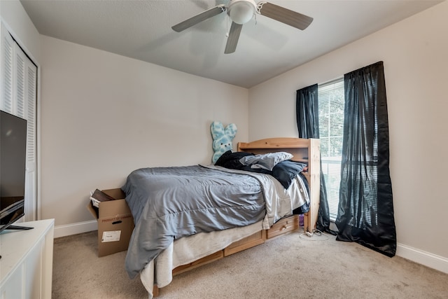 bedroom with light carpet and ceiling fan