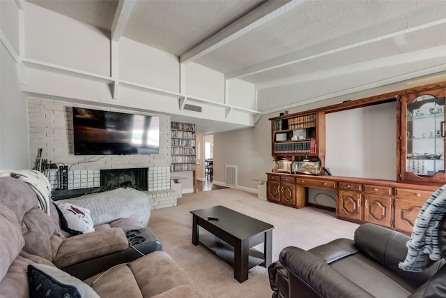 carpeted living room featuring beam ceiling, a textured ceiling, and a fireplace