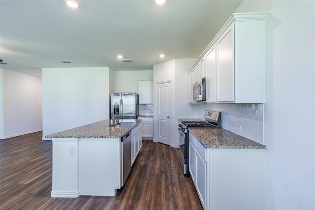 6049 Pensby Dr, Celina, TX 76227 - kitchen featuring stone countertops, dark wood-style floors, a sink, and stainless steel appliances