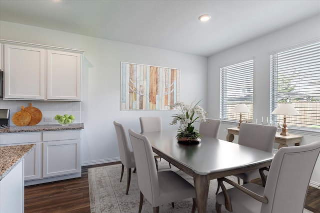 dining space featuring dark hardwood / wood-style flooring