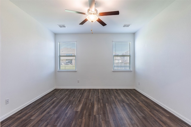 empty room featuring ceiling fan and dark hardwood / wood-style floors