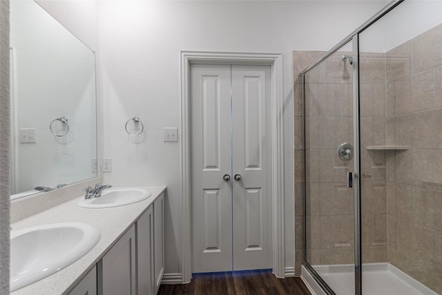 6049 Pensby Dr, Celina, TX 76227 - full bathroom with a sink, a stall shower, and wood finished floors