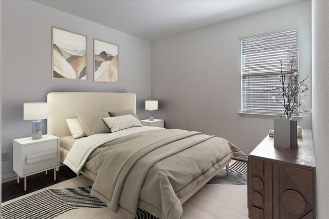 bedroom with light hardwood / wood-style floors