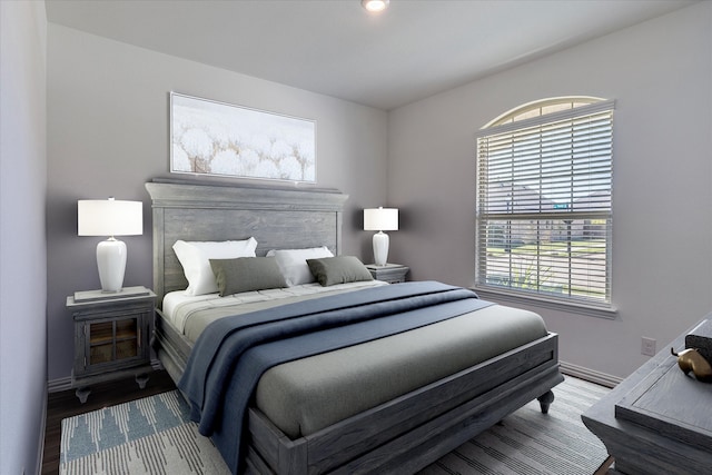 bedroom with hardwood / wood-style floors