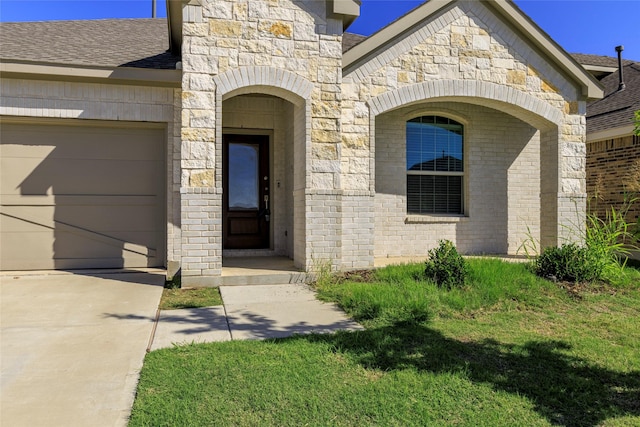 6049 Pensby Dr, Celina, TX 76227 - doorway to property featuring roof with shingles, an attached garage, stone siding, driveway, and brick siding