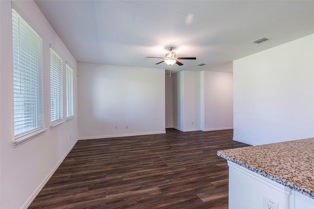 6049 Pensby Dr, Celina, TX 76227 - unfurnished living room featuring dark wood finished floors, baseboards, visible vents, and a ceiling fan