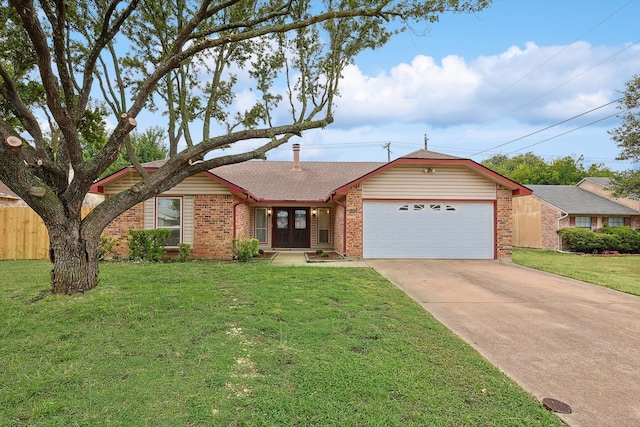 ranch-style home with a front yard and a garage