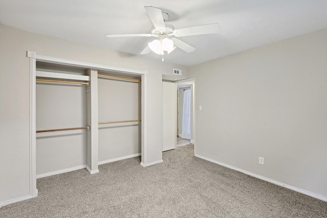 unfurnished bedroom with a closet, ceiling fan, and carpet floors