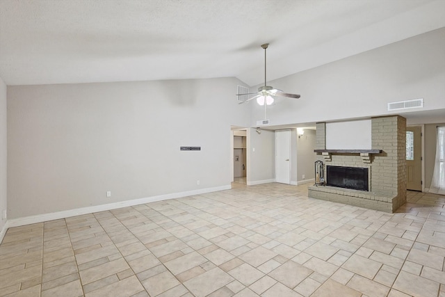 unfurnished living room with high vaulted ceiling, ceiling fan, and a brick fireplace