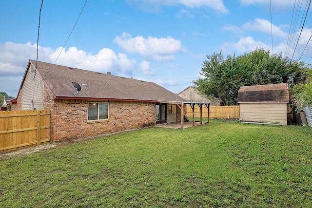 view of yard with a patio and a shed