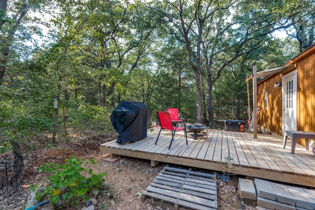 wooden terrace featuring grilling area