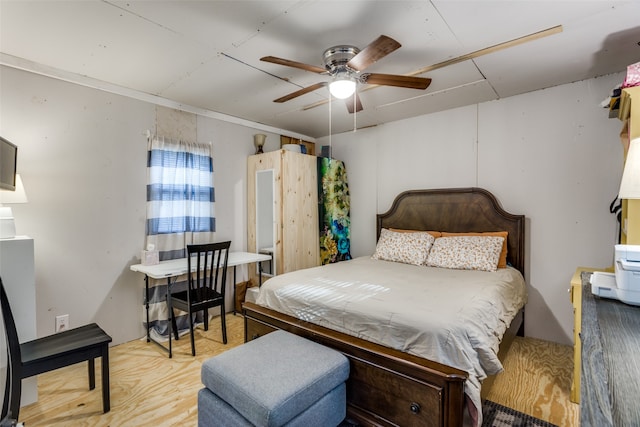 bedroom with ceiling fan and light wood-type flooring