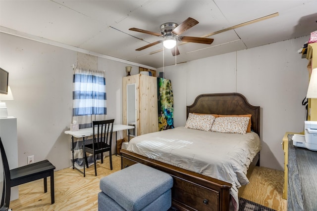 322 Boone, Alvarado, TX 76009 - bedroom featuring ceiling fan and wood finished floors