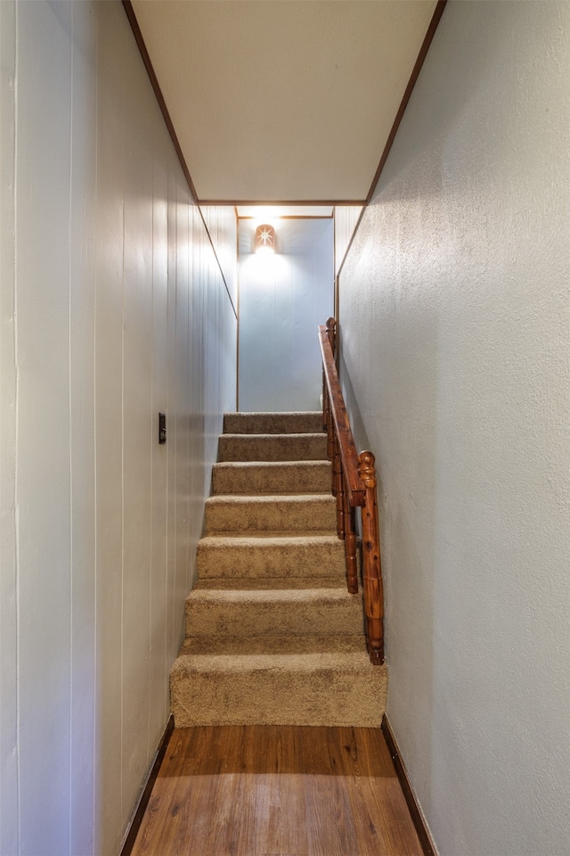 stairway featuring hardwood / wood-style flooring