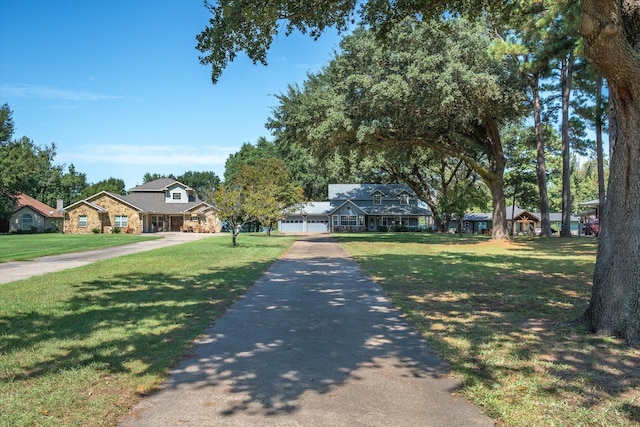 view of front of property with a front yard and a garage