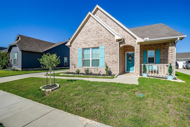 view of front of house featuring covered porch and a front yard