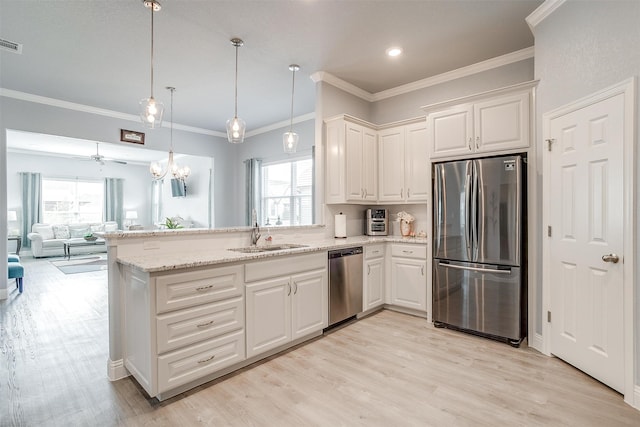 kitchen featuring sink, white cabinets, stainless steel appliances, and light hardwood / wood-style floors