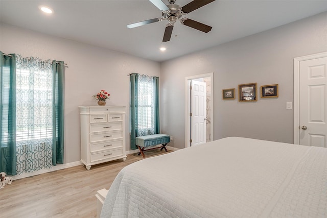 bedroom featuring light wood-type flooring and ceiling fan