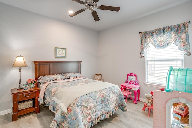 bedroom with light wood-type flooring and ceiling fan